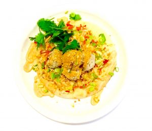 Thai pork meatballs with sweet chili Napa slaw, red curry yogurt, peanuts and naan